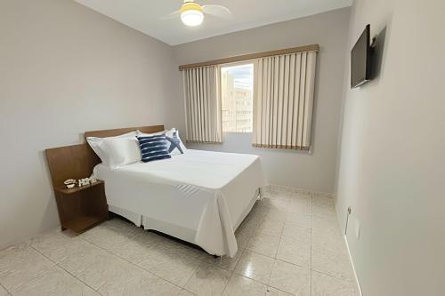 En eller flere senge i et værelse på Belíssimo Apê, a 5 min da Praia, até 4 pessoas.