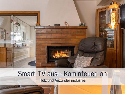 TV a/nebo společenská místnost v ubytování Ferienwohnung KUMM RIN - Oase an der Nordsee