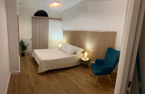 En eller flere senge i et værelse på Le nid des agrumes