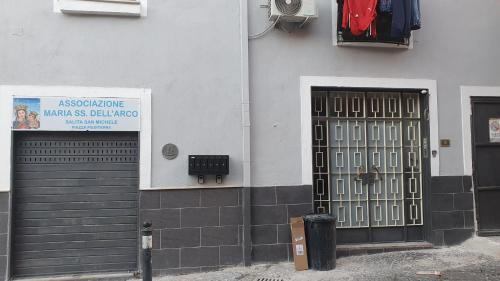 a building with a door with a sign on it at Bilocale Ottaviano City Sunflower in Ottaviano