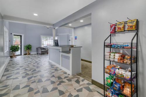 an office with a refrigerator and a shelf with food at Yankee Clipper Inn, SureStay Collection by Best Western in North Conway