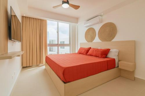 a bedroom with a bed and a large window at Casa Luma Vistacana in Pueblo Bavaro