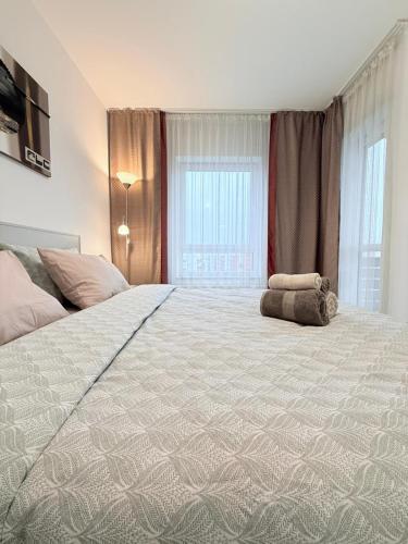 a bedroom with a large bed with a stuffed animal on it at Casa MIO in Braşov