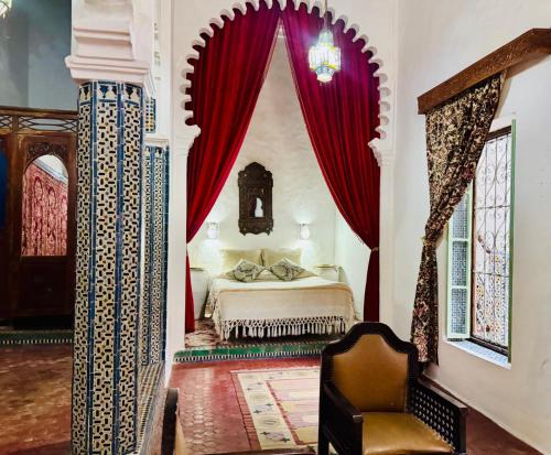 Ένα ή περισσότερα κρεβάτια σε δωμάτιο στο Hotel Dar Dalia Tetouan