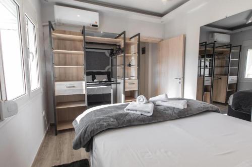 Ένα ή περισσότερα κρεβάτια σε δωμάτιο στο Aristotelous Amelia House