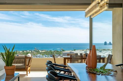 a dining room with a table and a view of the ocean at Serene Oceanview Getaway with Private Terrace in Cabo San Lucas