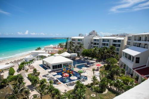 an aerial view of the resort and the beach at BeachAccess HotelZone 3705 in Cancún