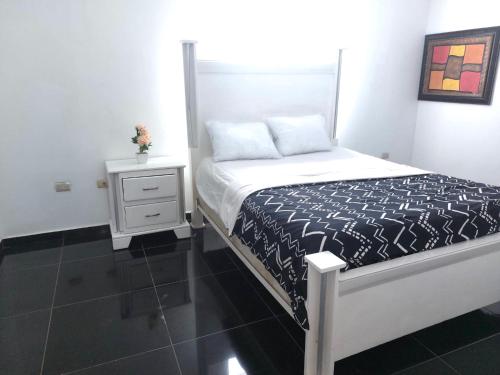 Ένα ή περισσότερα κρεβάτια σε δωμάτιο στο Villa Maryluz