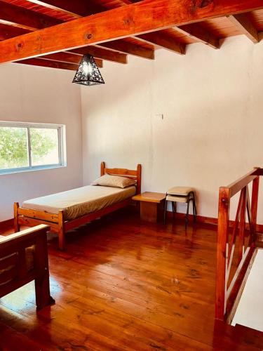 Ένα ή περισσότερα κρεβάτια σε δωμάτιο στο La casa del arbol