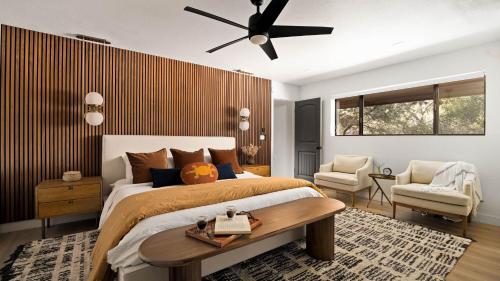 a bedroom with a bed and a ceiling fan at Roca Roja by AvantStay Mountain Views in the Heart of Sedona in Sedona