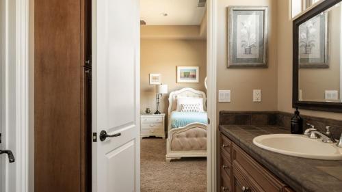 a bathroom with a sink and a mirror at Sangiovese By AvantStay Spectacular Estate w Pool Hot Tub Putting Green in Temecula