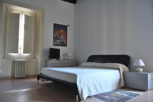 Postel nebo postele na pokoji v ubytování B&B Pozzo dei Desideri