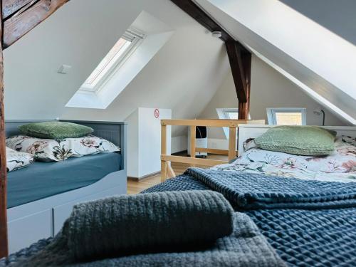 En eller flere senge i et værelse på Rezydencja Sudecka