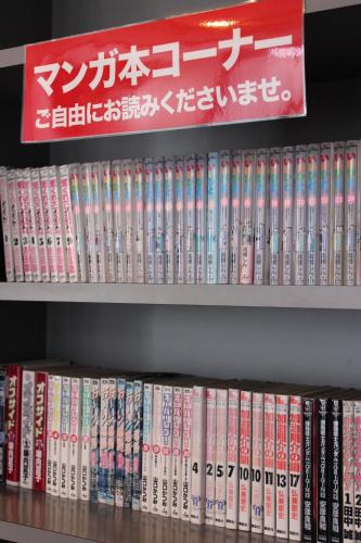 a shelf full of books in a book store at Hotel Crown Hills Takaoka in Takaoka