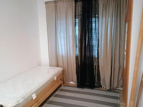 Postel nebo postele na pokoji v ubytování Ana Apartment River Sava