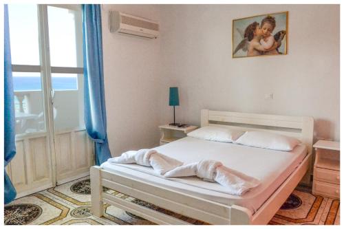 Postel nebo postele na pokoji v ubytování Athena Pallas