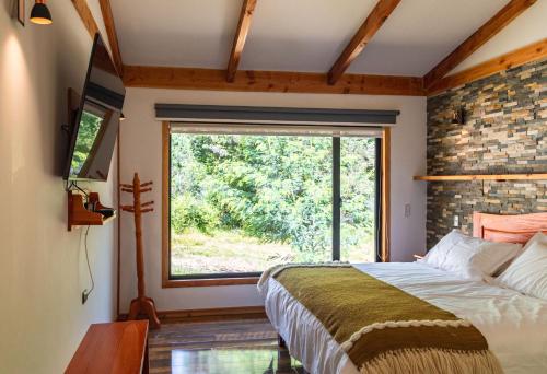 Postel nebo postele na pokoji v ubytování Lican Lodge