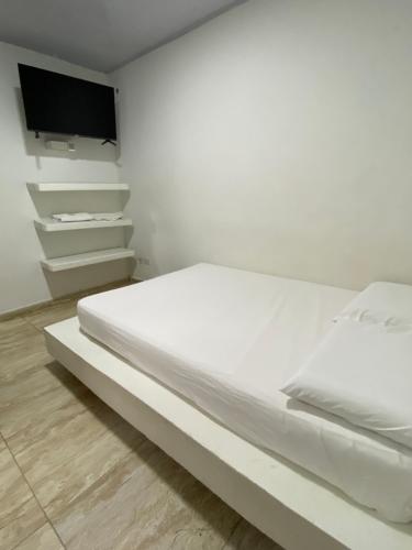 Postel nebo postele na pokoji v ubytování Hotel Nellamar