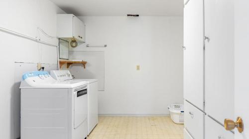 a white laundry room with a washer and dryer at Saratoga by the Sea by AvantStay Panoramic View Near Langley in Langley