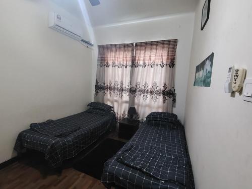 Una cama o camas en una habitación de Ray Guest house