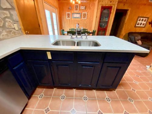 a kitchen with a sink and a counter top at Kickin Back in Concan