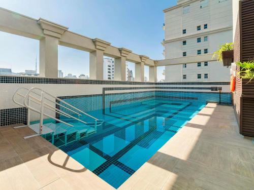 a swimming pool on the side of a building at Novotel SP Jardins in Sao Paulo