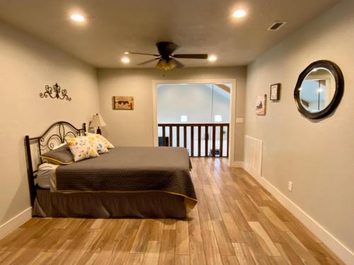 a bedroom with a bed and a ceiling fan at Pretty Penny in Concan