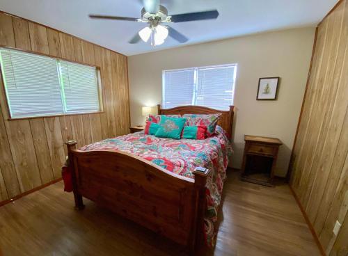 a bedroom with a bed and a ceiling fan at North Star in Concan