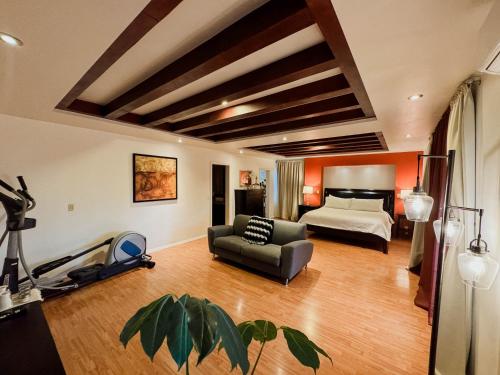 Ένα ή περισσότερα κρεβάτια σε δωμάτιο στο Tierra Mia Hacienda Ruta del Vino