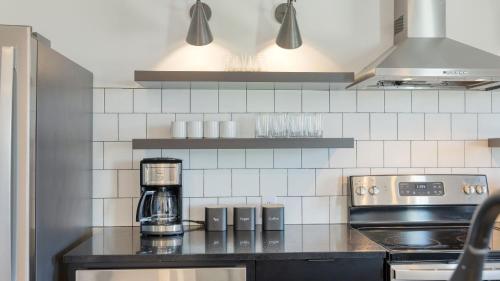 a kitchen with a coffeemaker on a counter at The Carter by AvantStay in Nashville