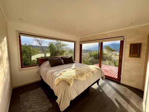 En eller flere senge i et værelse på Cabaña Mirador