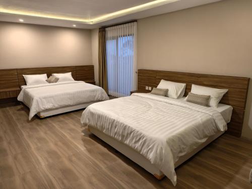 Postel nebo postele na pokoji v ubytování Sunriver Hotel