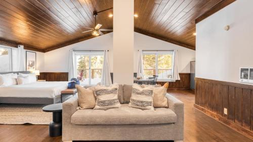 a living room with a couch and a bed at Explorer by AvantStay Close to Slopes Game Room Guest Suite Hot Tub in Alpine Meadows