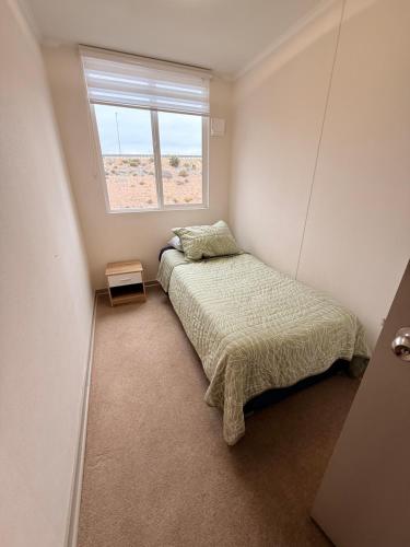 Una cama o camas en una habitación de Departamento Arriendo Diario