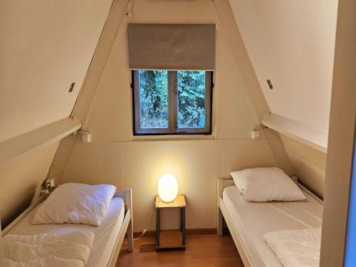 Ένα ή περισσότερα κρεβάτια σε δωμάτιο στο Serene Vacation Chalet in Durbuy