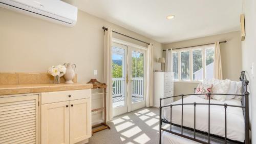 a kitchen with a bed in a room with a window at Sonoma Sunshine by AvantStay Countryside Views in Glen Ellen