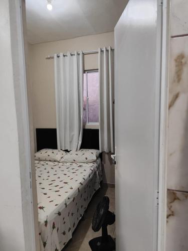 Giường trong phòng chung tại Casa dos pássaros