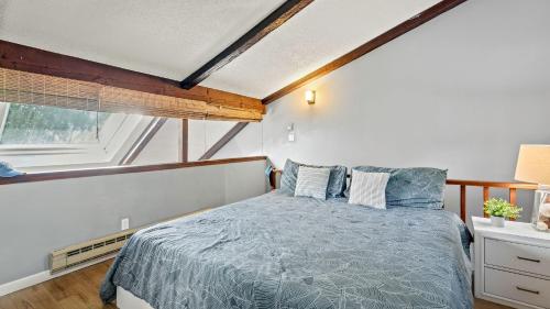 a bedroom with a bed and a window at Timberline Retreat by AvantStay Forest Views Minutes to Camelback Resort in Tannersville