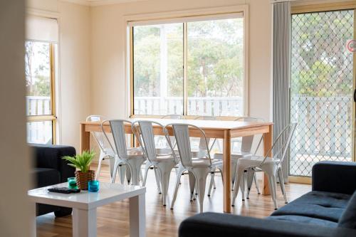 a dining room with a table and chairs at The Black Dolphin Holiday Park in Merimbula