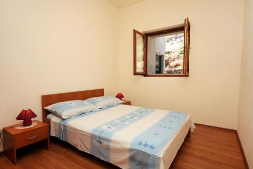 Postel nebo postele na pokoji v ubytování Apartment Saplunara 4923b