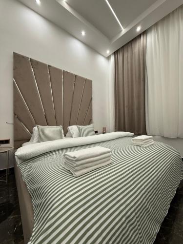 Ένα ή περισσότερα κρεβάτια σε δωμάτιο στο Luxury Gold apartman