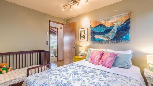 a bedroom with a bed and a painting on the wall at Saratoga Vista by AvantStay Waterfront Views in Langley