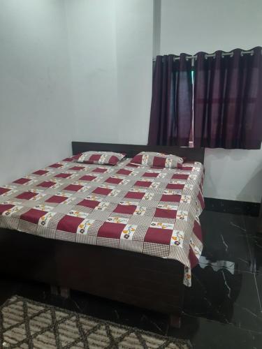 a bed sitting in a room with at DS Villa in Noida