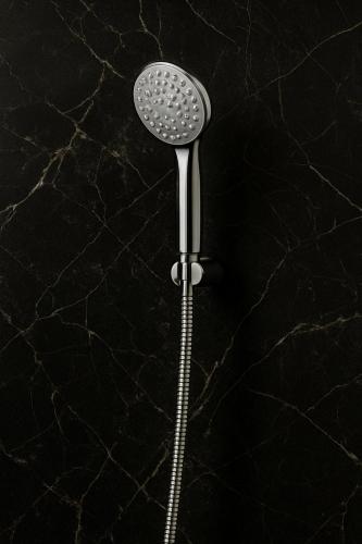 a shower head on a black counter top at Road House Resort in Rāmeswaram