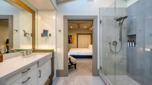 a bathroom with a shower and a sink and a mirror at Private Pool Firepit Wine Room Near Top Paso Wineries Devi Ranch in Paso Robles