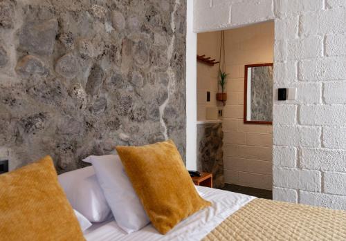 Una cama o camas en una habitación de Hostel Pimampiro