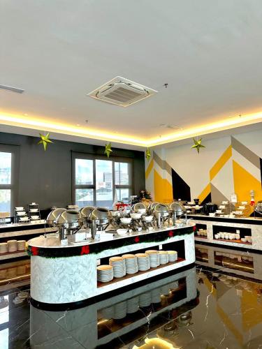 a large kitchen with lots of pots and pans at 56 Hotel in Kuching