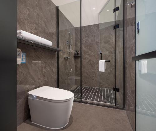 Un baño de Huanman Hotel Jishou State Government Branch