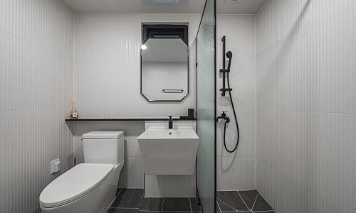 a bathroom with a toilet and a sink and a shower at Chuncheon Bali 376 in Chuncheon