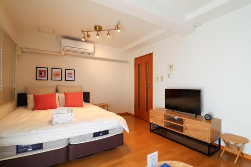 Postel nebo postele na pokoji v ubytování Al Di La 四谷